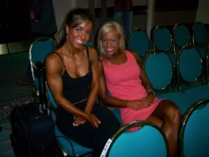 Catherine and Misty sitting together smiling for the camera.