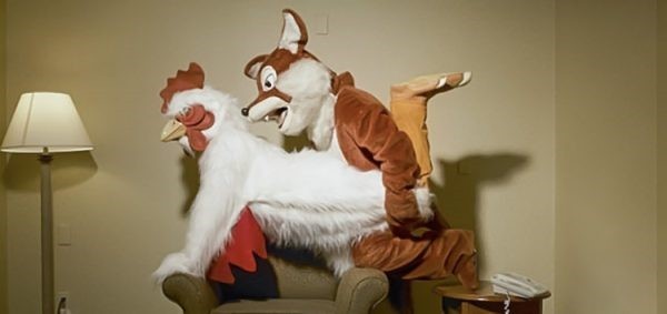 Two people appearing to have doggy style sex in their furry costumes.